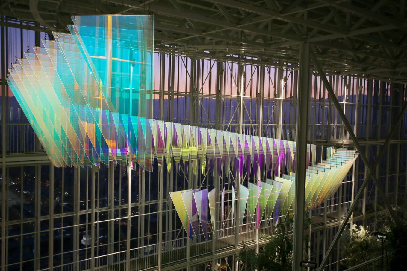 3M iridescent window film was used in this skyscraper display in Turin, Italy, where triangular pieces of glass hung from the ceiling in the shape of an alpha symbol.